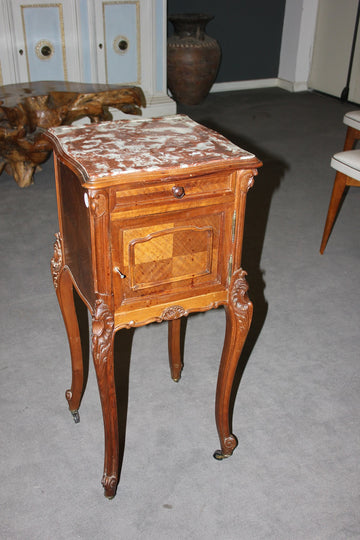 French bedside table in Louis Philippe style with carvings and marble top, 19th century