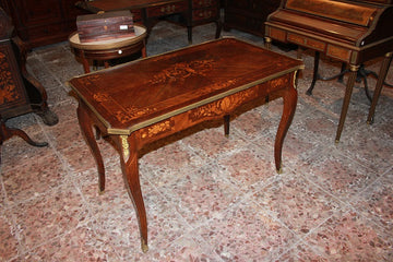 French Louis XV style writing table from 1800 with bronzes and rich inlay motifs