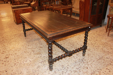 Large French table from the early 19th century in walnut wood with carvings