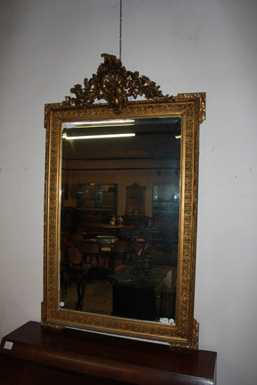 French Louis XVI style mirror in 19th century gilt wood