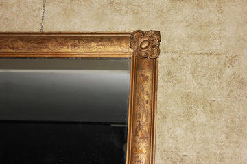 French symmetrical mirror from the second half of the 19th century, Louis XVI style in gilded and engraved wood