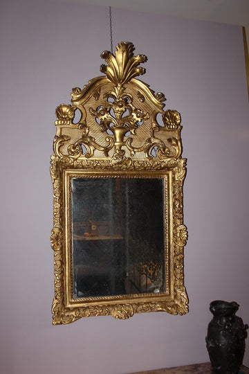 French mirror from the second half of the 18th century in gold leaf gilded wood