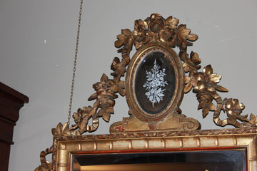 Magnificent French mirror from the first half of the 19th century, gilded with gold leaf and rich friezes