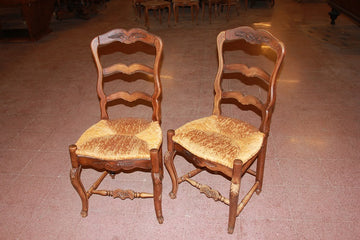 Group of 10 French Provençal style chairs in richly carved walnut wood