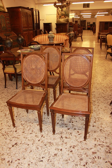 A group of 8 Louis XVI chairs from the 1800s in mahogany wood with cane seats