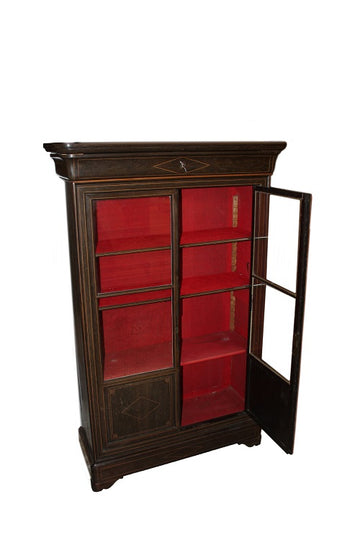 French bookcase from the 1800s, Charles X style, in ebony wood with inlays