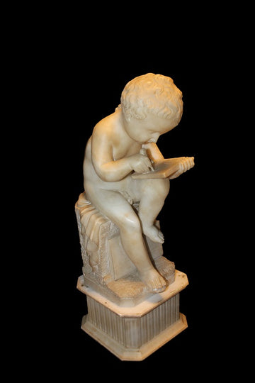 French marble sculpture from the 1800s depicting a putto