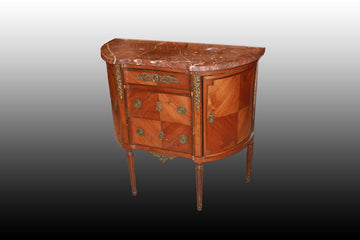 French Louis XVI style chest of drawers with a bevelled shape from the 1800s with marble and bronze