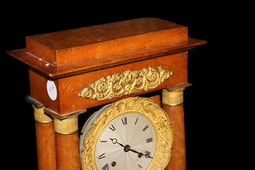 French Empire style mantel clock in elm root with bronze applications and richly finished pendulum