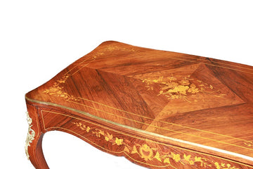 French Louis XV style desk with rich marquetry patterns and gilt bronze applications