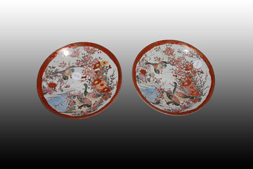 Pair of Chinese porcelain plates decorated with a lake scene