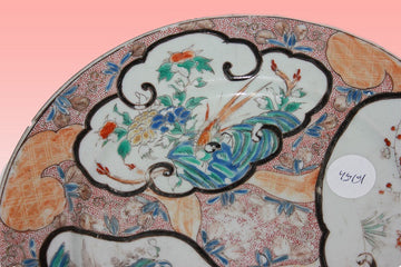 Chinese porcelain plate richly decorated with three vignettes