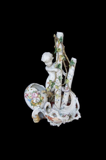 Antique porcelain centerpiece from the 1800s with putto