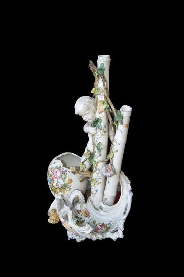 Antique porcelain centerpiece from the 1800s with putto