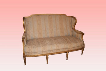 Antique French gilt Louis XVI style sofa from 1800