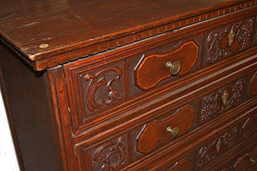 Antique Italian chest of drawers from the 1600s in Renaissance style walnut