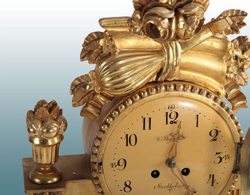 Antique Northern European table mantel clock from 1900 in gilded wood