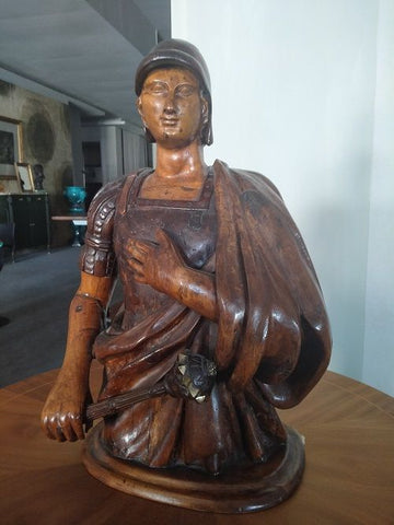 Antique wooden statue of a legionary with a mace from the 17th century