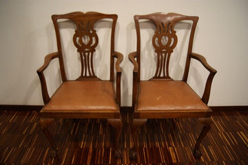 Group of antique chairs with Chippendale style mahogany table top