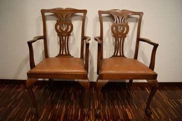 Group of antique chairs with Chippendale style mahogany table top