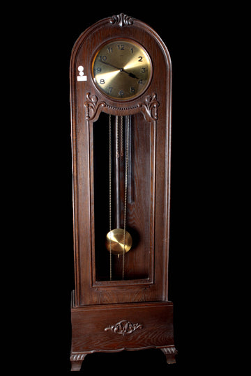 Art Deco style column clock in carved oak, from the early 1900s