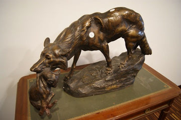 She-wolf with cub in her mouth sculpture signed Thomas François Cartier