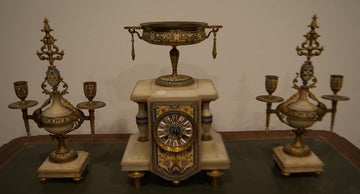 French triptych mantel clock and candlesticks in decorated marble and bronze