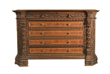 Antique Italian chest of drawers from the 1500s in richly carved walnut