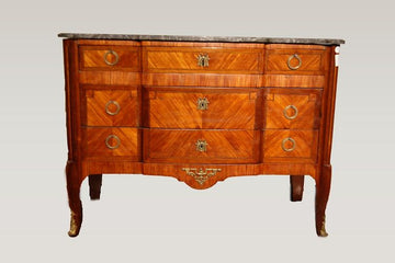 19th century French Transition style chest of drawers in mahogany and bois de rose