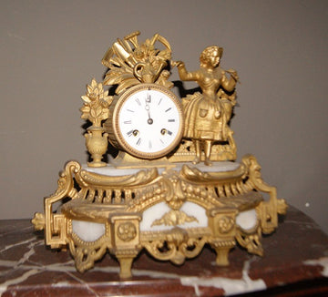 French mantel clock from the 1800s depicting a female character