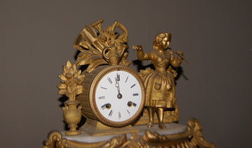French mantel clock from the 1800s depicting a female character