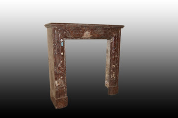 Small French fireplace from the 19th century in Empire style red marble