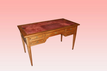 Louis XVI style writing desk from the early 1900s in cherry wood with leather top