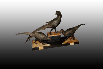 French Art Deco sculpture from the early 1900s in bronze depicting Peacocks