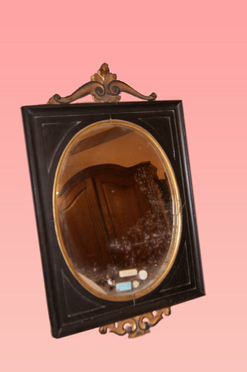 Italian Louis XVI style mirror in black lacquered wood and gold leaf gilded wood trim