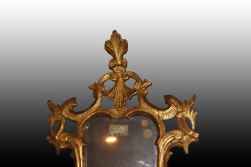 Superb small Italian mirror from the 1700s in gilded gold leaf
