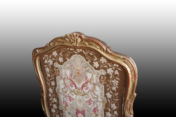 French spark screen from the 1800s in gold leaf gilded wood with small stitch embroidered fabric