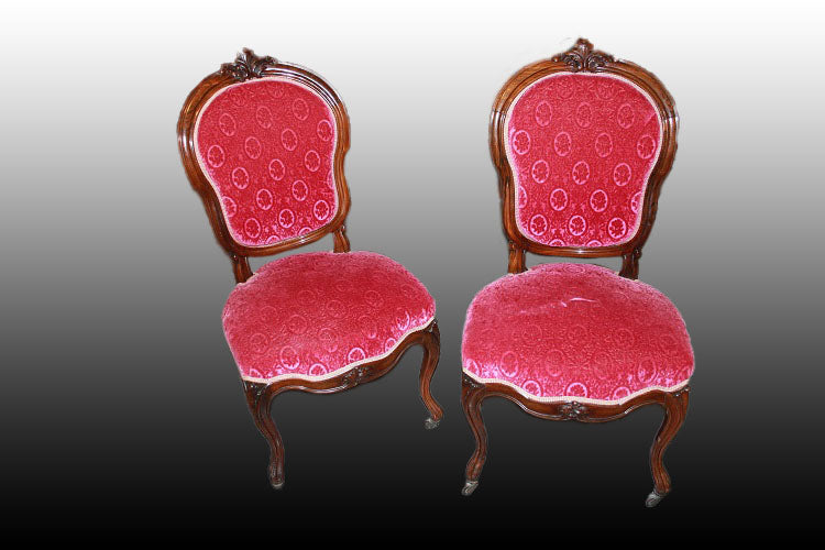 Groupe de 4 chaises de style Louis Philippe en palissandre à motifs sculptés