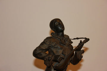 Small French bronze sculpture from 1800 depicting Pierrot with Guitar