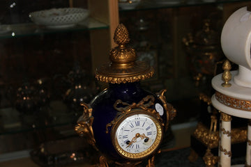 French mantel clock from the 1800s in wood, bronze, and blue Opaline
