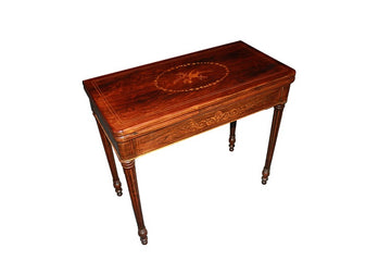 Table jeux française de la première moitié du 19ème siècle, de style Charles X, en palissandre avec marqueteries