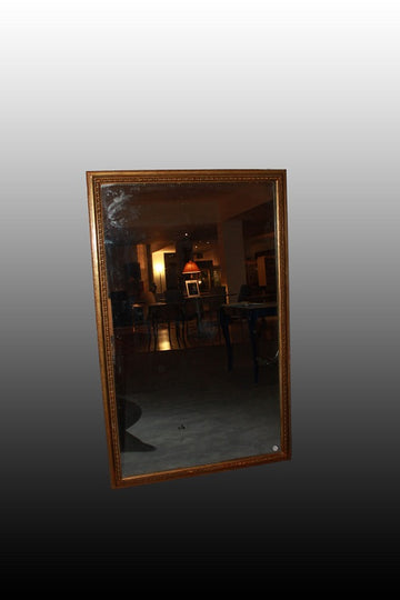 Grand miroir symétrique rectangulaire doré de style Louis XVI du 20ème siècle