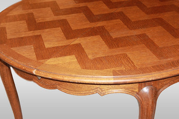 Extendable circular Provençal table from the early 1900s in oak wood with parquet top