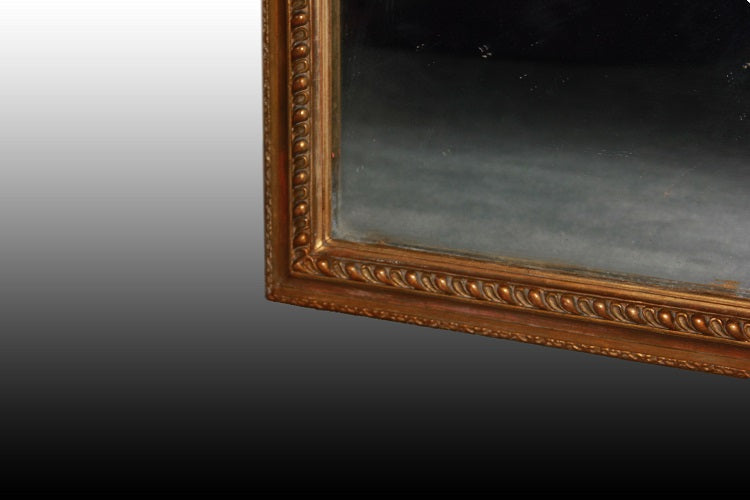 Grande specchiera stile Luigi XVI dorata rettangolare simmetrica XX secolo