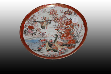 Paire d'assiettes en porcelaine de Chine à décor d'une scène lacustre