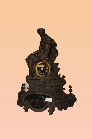 Antique French mantel clock depicting a lady from the 1800s