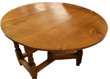 Antique French oval solid oak table from the 19th century with wings