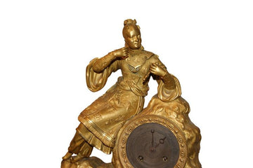 Pendule ancienne de style Empire français du 19ème siècle en bronze doré