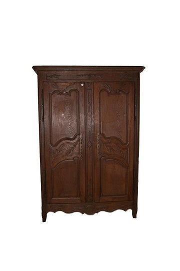 Antique wardrobe from the 1700s in French Provencal style carved wood