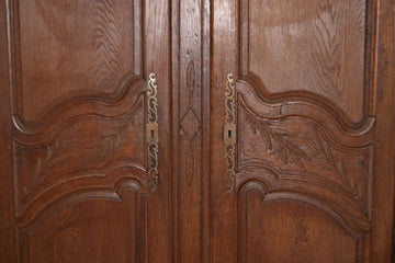 Antique wardrobe from the 1700s in French Provencal style carved wood
